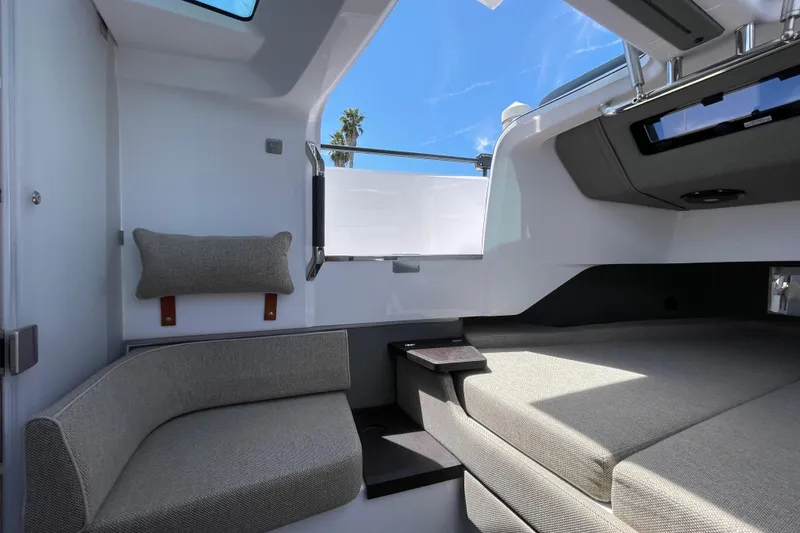 Slide: The Image of Interior of 2023 Axopar 37 XC Cross Cabin with modern seating and skylight. - 42