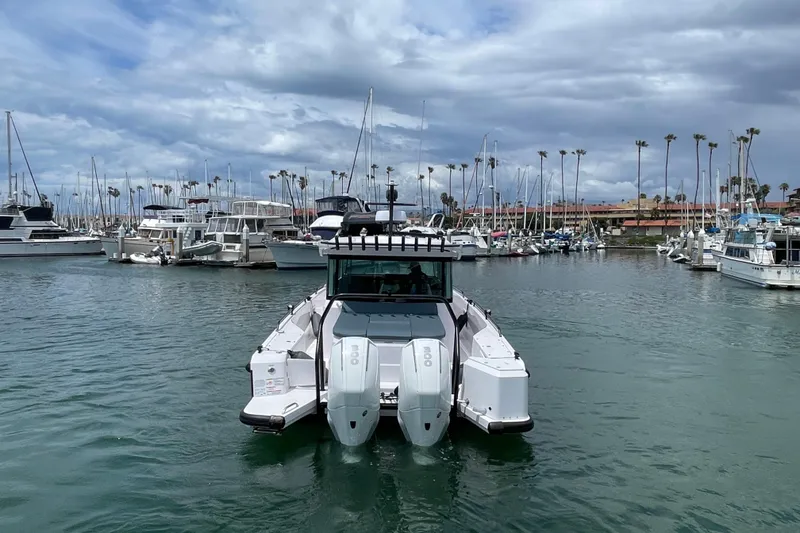 Slide: The Image of 2023 Axopar Brabus 37 XC in harbor with boats and palm trees. - 5