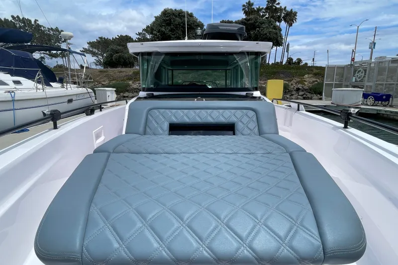 Slide: The Image of 2023 Axopar Brabus 37 XC with luxurious upholstery design at the harbor. - 9