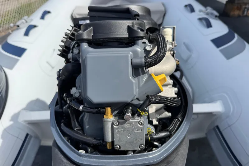 Slide: The Image of Close-up of a 2023 Highfield Ultralite 310 boat engine, showcasing intricate mechanical details. - 15