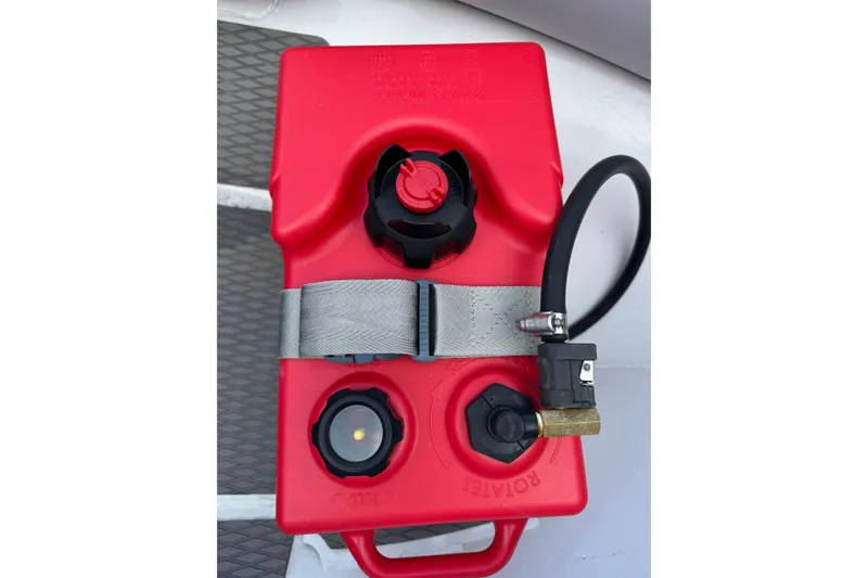 Slide: The Image of Red fuel tank on Highfield Ultralite 310 boat, 2023 model, with attached hose. - 18