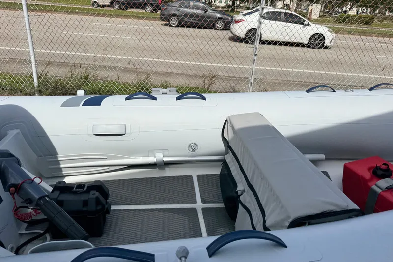 Slide: The Image of 2023 Highfield Ultralite 310 inflatable boat interior with seating and equipment. - 8