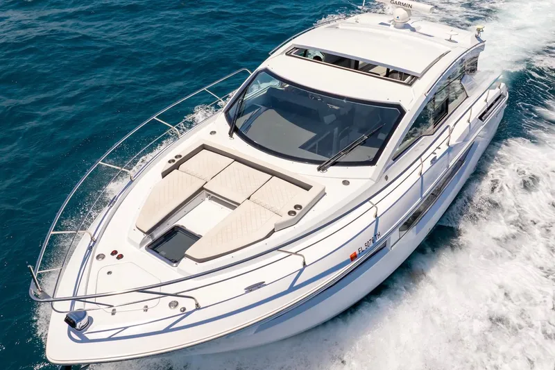 Slide: The Image of 2022 Cruisers Yachts 42 Cantius cruising on blue ocean waters. - 16