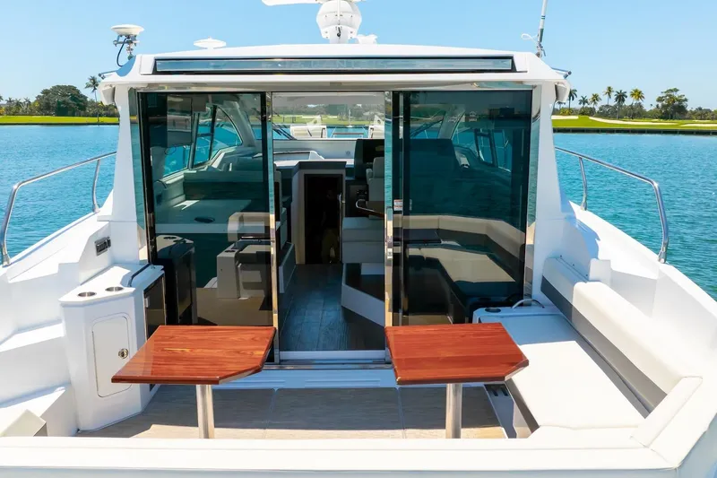 Slide: The Image of 2022 Cruisers Yachts 42 Cantius luxury yacht with open deck and sleek interior design. - 18