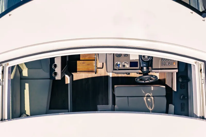 Slide: The Image of Top view of 2022 Cruisers Yachts 42 Cantius helm and seating area. - 20