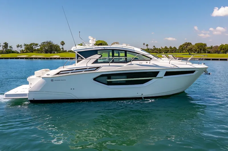 Slide: The Image of 2022 Cruisers Yachts 42 Cantius on serene water, showcasing sleek design and luxury features. - 21