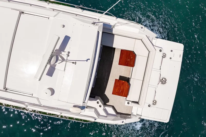 Slide: The Image of Aerial view of 2022 Cruisers Yachts 42 Cantius on blue water. - 22