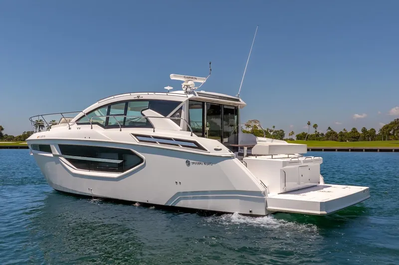 Slide: The Image of 2022 Cruisers Yachts 42 Cantius on water, showcasing sleek design and modern features. - 23