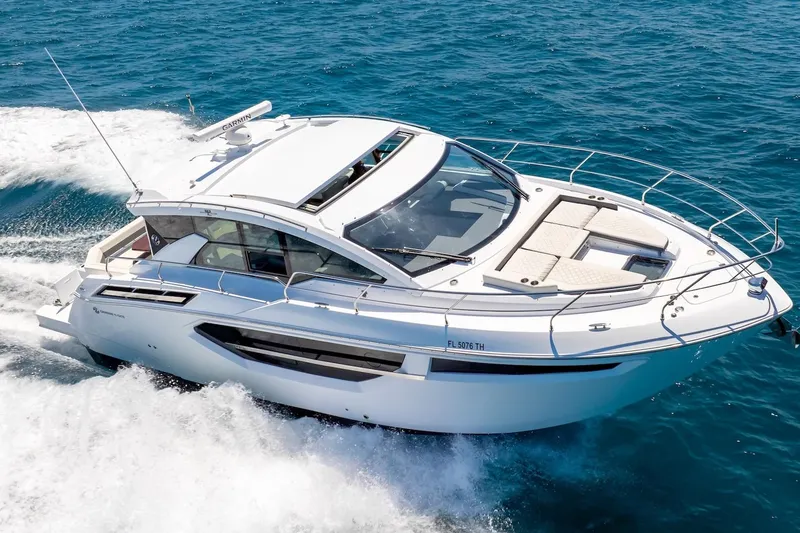Slide: The Image of 2022 Cruisers Yachts 42 Cantius cruising on open blue water. - 24