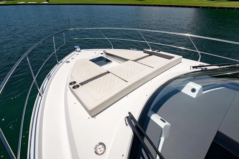 Slide: The Image of 2022 Cruisers Yachts 42 Cantius bow with sunpad, on calm water. - 27