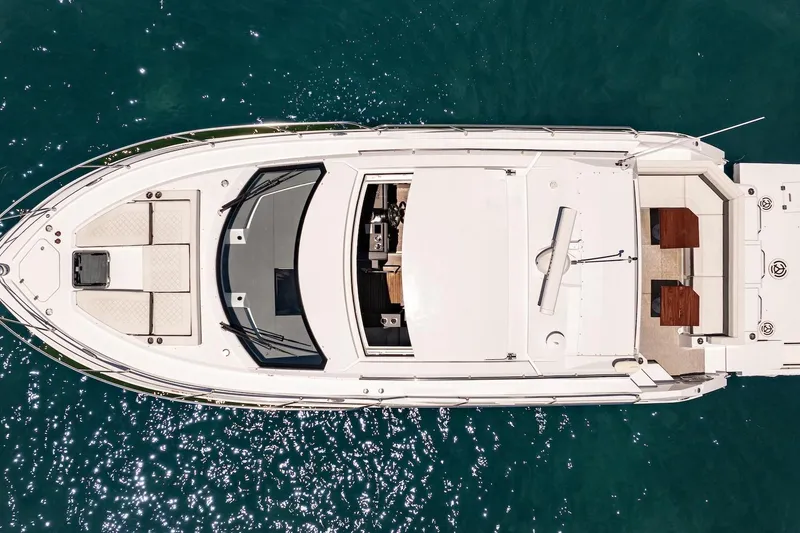 Slide: The Image of Top view of 2022 Cruisers Yachts 42 Cantius on sparkling blue water. - 3
