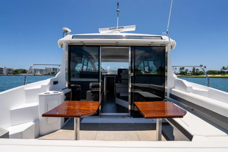 Slide: The Image of 2022 Cruisers Yachts 42 Cantius, luxury yacht interior with open deck and seating area. - 31