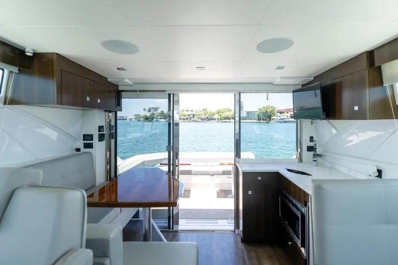 Slide: The Image of Interior of 2022 Cruisers Yachts 42 Cantius with modern kitchen and waterfront view. - 32