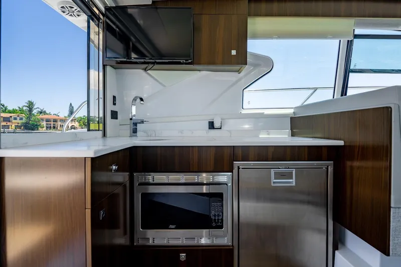Slide: The Image of Luxurious 2022 Cruisers Yachts 42 Cantius interior kitchen with modern appliances and sleek design. - 33
