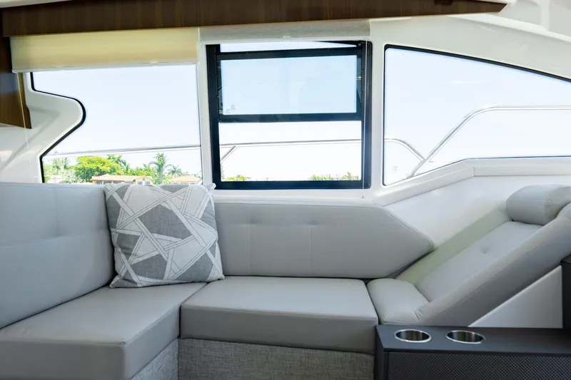 Slide: The Image of Luxurious interior of 2022 Cruisers Yachts 42 Cantius with modern seating and window view. - 39