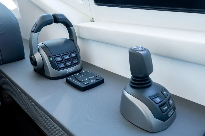 Slide: The Image of Control panel of 2022 Cruisers Yachts 42 Cantius featuring joystick and throttle controls. - 41