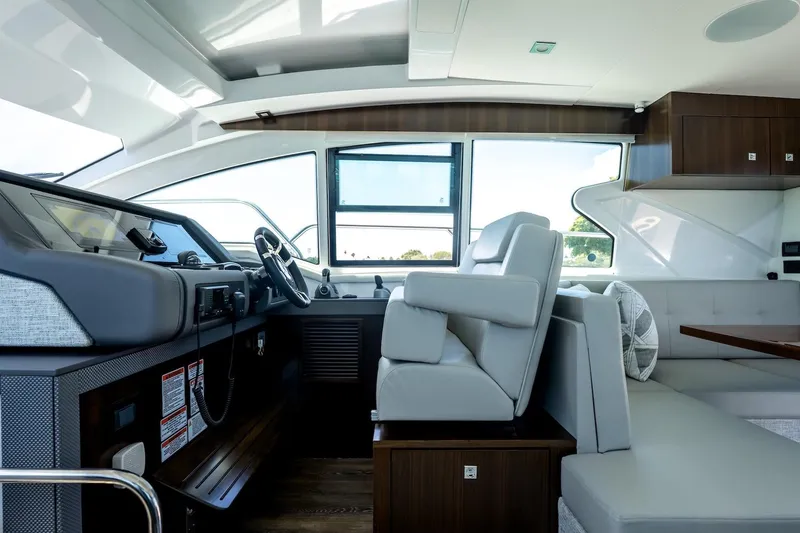 Slide: The Image of Interior of 2022 Cruisers Yachts 42 Cantius, featuring modern helm and seating area. - 43