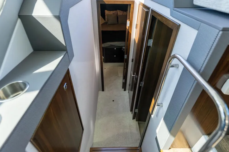 Slide: The Image of Interior hallway of 2022 Cruisers Yachts 42 Cantius, featuring modern design and wood finishes. - 44