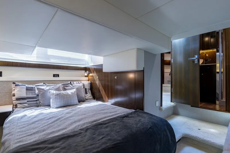 Slide: The Image of Luxurious bedroom interior of 2022 Cruisers Yachts 42 Cantius with modern design and cozy bedding. - 49