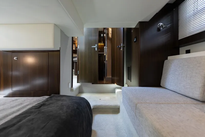 Slide: The Image of Luxurious interior of 2022 Cruisers Yachts 42 Cantius with modern furnishings and wood accents. - 52