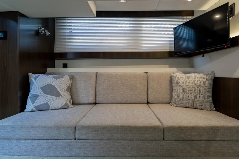 Slide: The Image of Luxurious interior of 2022 Cruisers Yachts 42 Cantius with sofa and TV. - 53