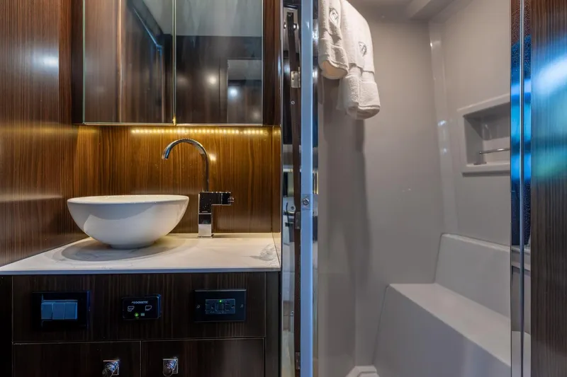 Slide: The Image of Luxurious bathroom interior of 2022 Cruisers Yachts 42 Cantius with modern sink and shower. - 54