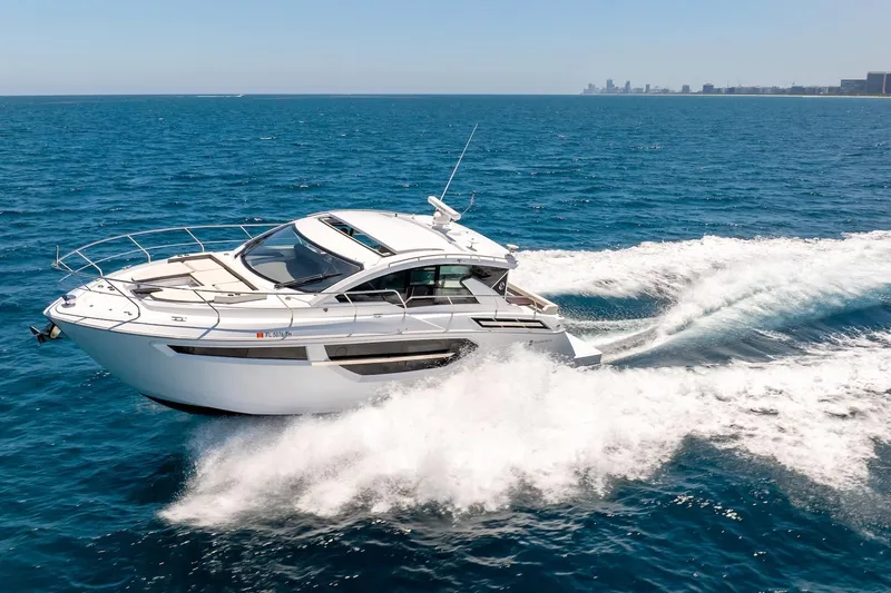 Slide: The Image of 2022 Cruisers Yachts 42 Cantius cruising on open blue ocean waters. - 57