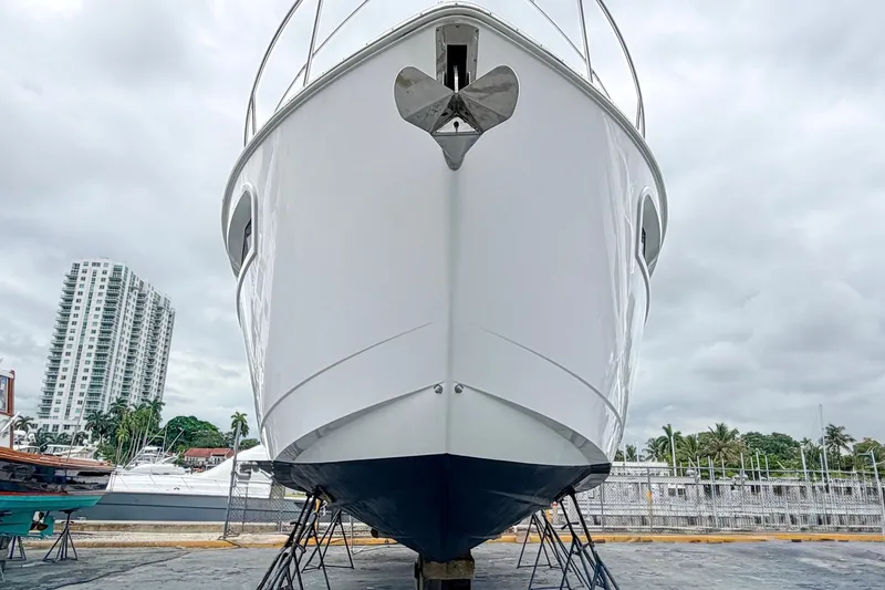 Slide: The Image of 2022 Cruisers Yachts 42 Cantius on dry dock with urban skyline backdrop. - 61
