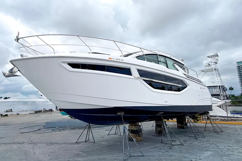 Slide: The Image of 2022 Cruisers Yachts 42 Cantius on dry dock, showcasing sleek design and modern features. - 62
