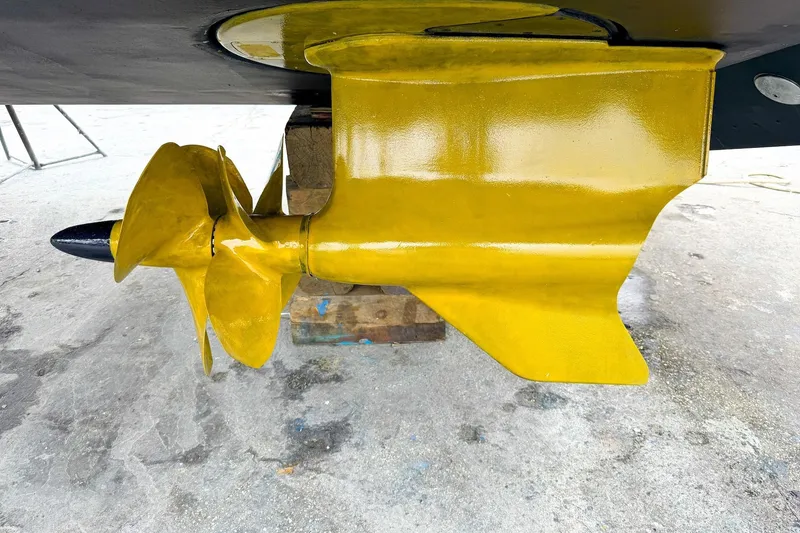 Slide: The Image of Yellow propeller and rudder of 2022 Cruisers Yachts 42 Cantius on dry dock. - 65