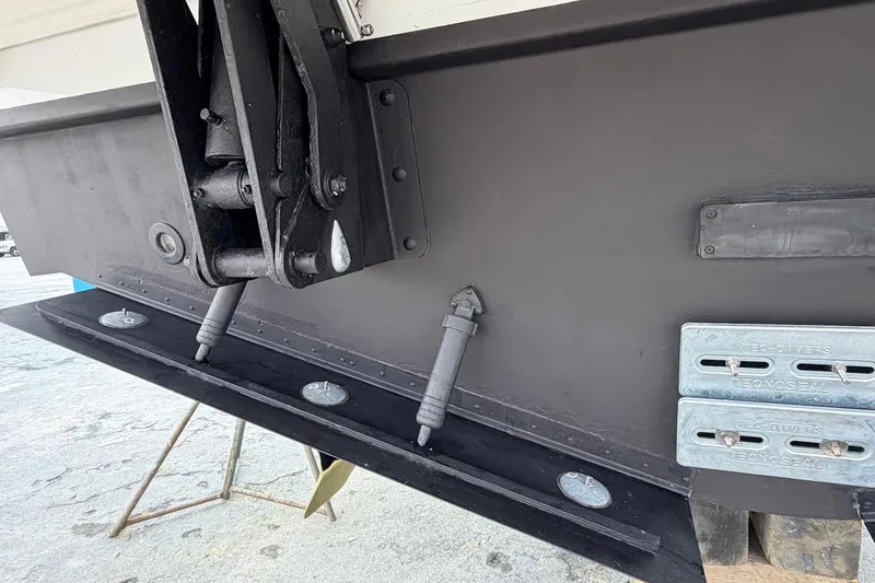 Slide: The Image of Close-up of 2022 Cruisers Yachts 42 Cantius hull with trim tabs and zinc anodes. - 67