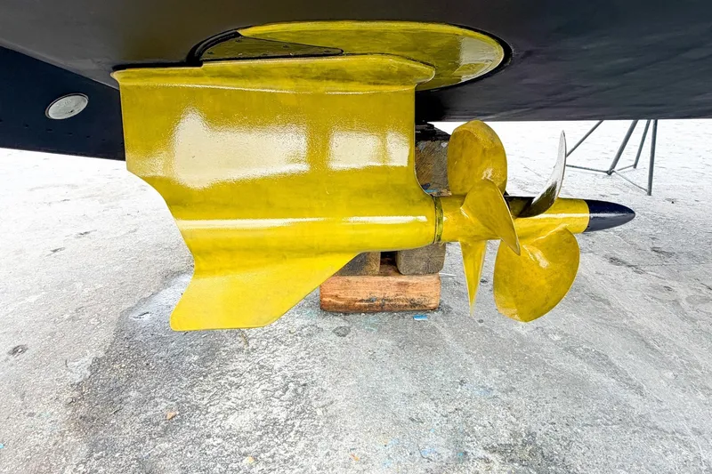 Slide: The Image of Yellow propeller of 2022 Cruisers Yachts 42 Cantius on dry dock. - 71