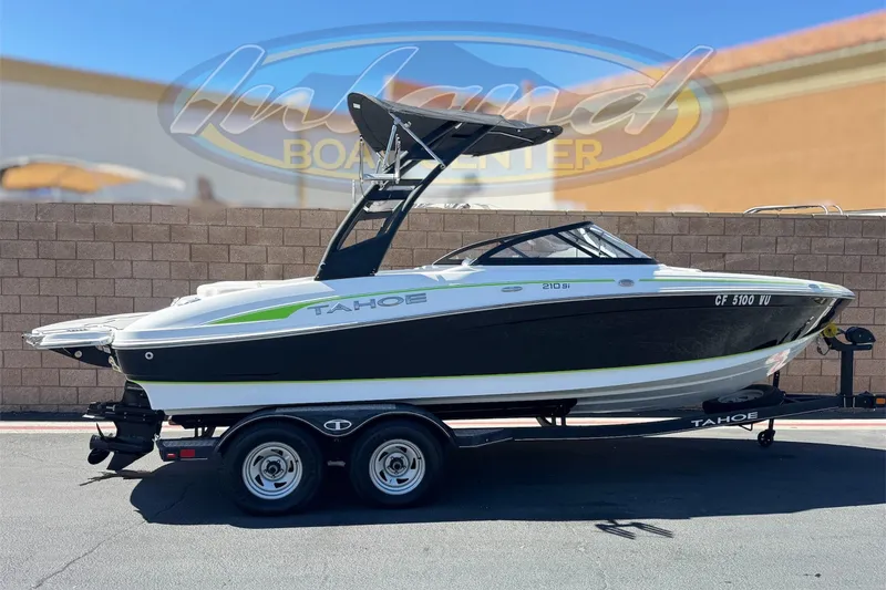The Image of 2022 Tahoe 210 Si Limited boat on trailer, displayed outdoors. - 0