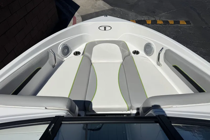 Slide: The Image of 2022 Tahoe 210 Si Limited boat interior with cushioned seating and speakers. - 10
