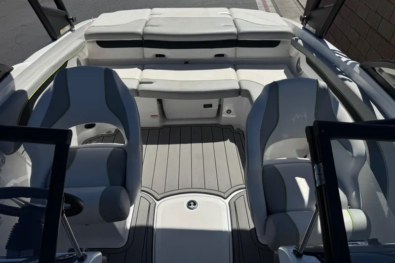 Slide: The Image of Interior of 2022 Tahoe 210 Si Limited boat with white seating and gray flooring. - 13