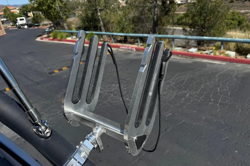 Slide: The Image of Wakeboard rack on a 2022 Tahoe 210 Si Limited boat, parked outdoors. - 15