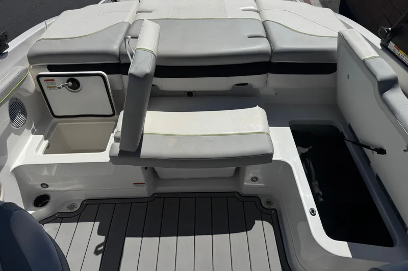 Slide: The Image of 2022 Tahoe 210 Si Limited boat interior with seating and storage compartments. - 16