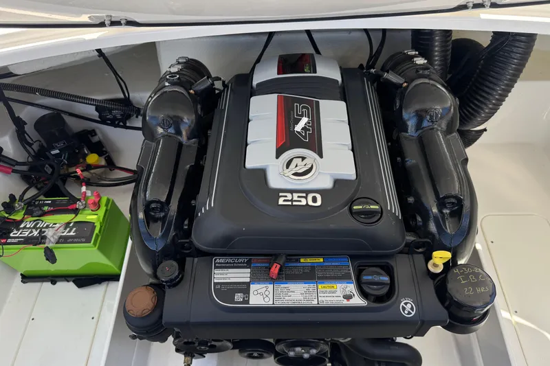 Slide: The Image of 2022 Tahoe 210 Si Limited boat engine compartment with Mercury 4.5L 250 HP engine. - 18