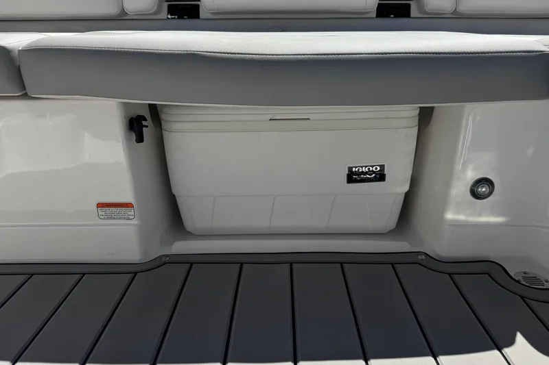 Slide: The Image of 2022 Tahoe 210 Si Limited boat with built-in Igloo cooler storage. - 19