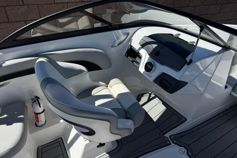Slide: The Image of 2022 Tahoe 210 Si Limited boat interior with sleek seating and modern dashboard design. - 23