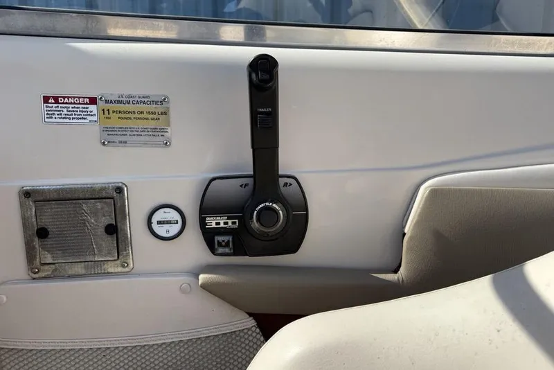 Slide: The Image of Control panel of a 1999 Glastron GT 225 boat with capacity warning label. - 10