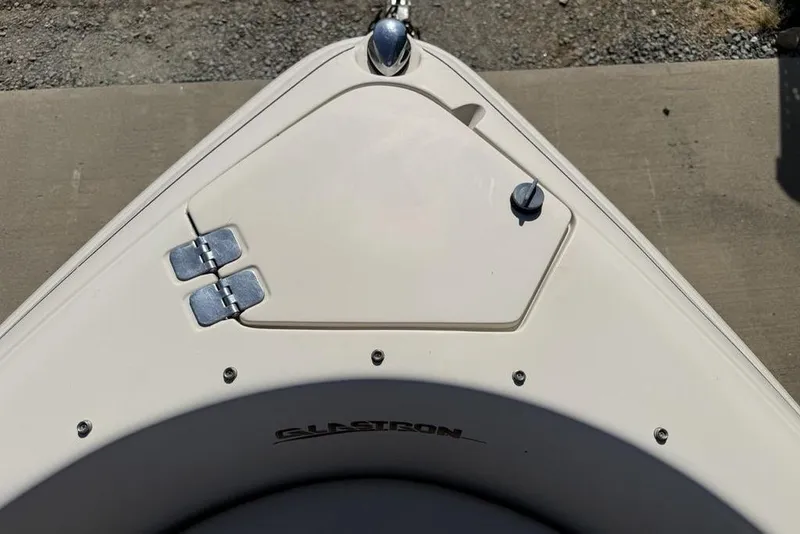 Slide: The Image of Bow of a 1999 Glastron GT 225 boat with hatch and hinges. - 18