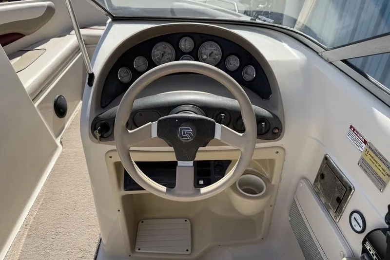 Slide: The Image of 1999 Glastron GT 225 boat dashboard with steering wheel and instrument panel. - 20