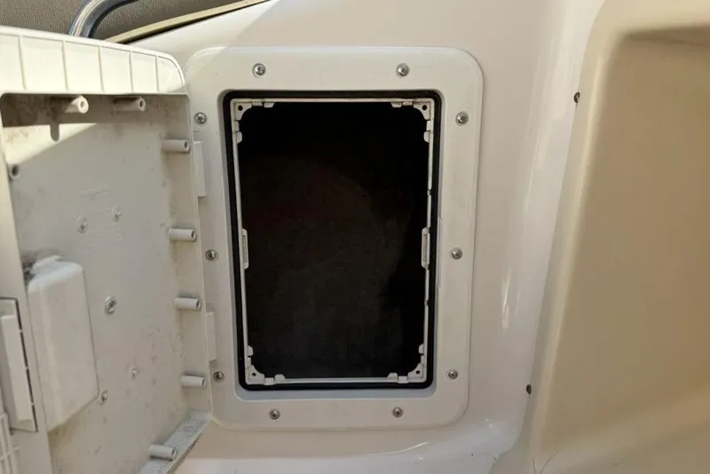 Slide: The Image of Open storage compartment on a 1999 Glastron GT 225 boat. - 28