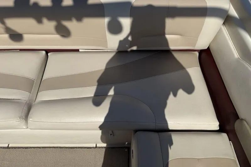 Slide: The Image of Shadow on beige leather seats of a 1999 Glastron GT 225 boat interior. - 33