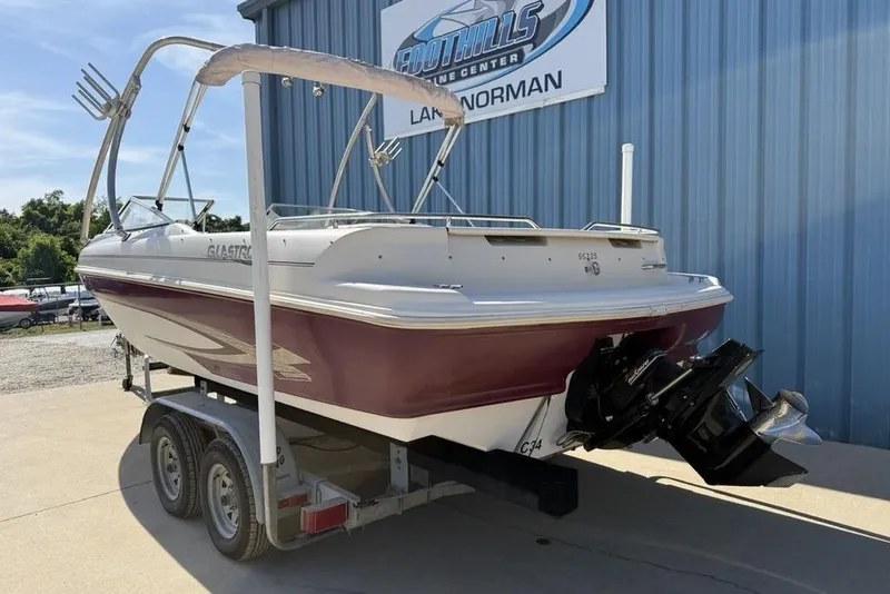 Slide: The Image of 1999 Glastron GT 225 boat on trailer at Foothills Marine Center. - 4