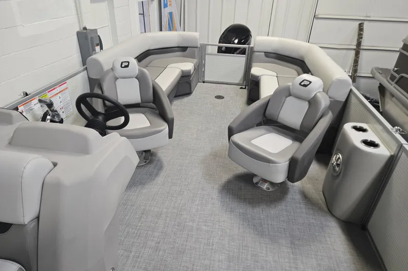 Slide: The Image of 2026 Princecraft Vectra 21 QL pontoon boat interior with gray seating and steering console. - 5