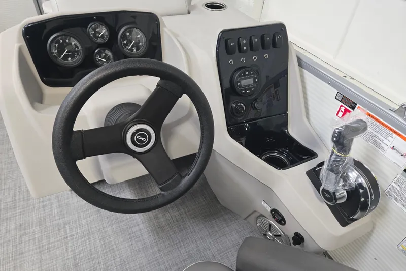 Slide: The Image of Steering console of 2026 Princecraft Vectra 21 QL boat with gauges and controls. - 6