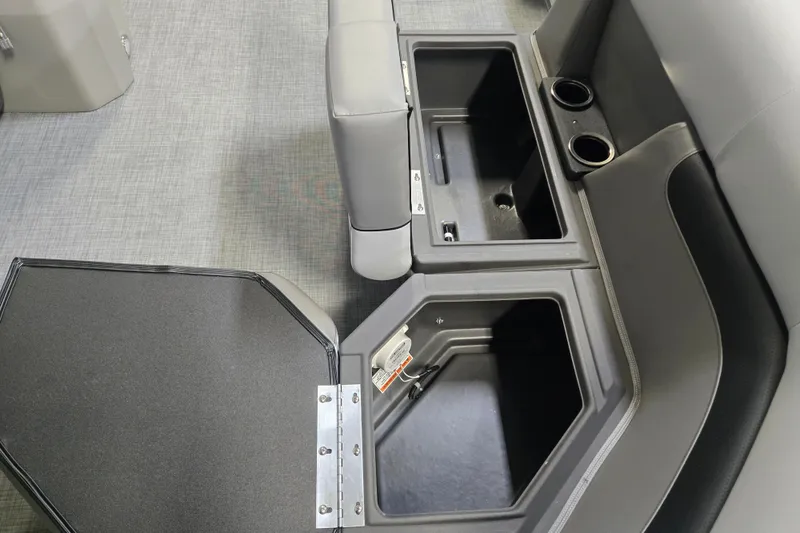 Slide: The Image of 2026 Princecraft Vectra 21 QL boat interior storage compartments and cup holders. - 7