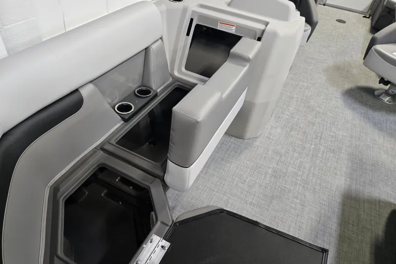 Slide: The Image of 2026 Princecraft Vectra 21 QL interior with storage compartments and cup holders. - 8